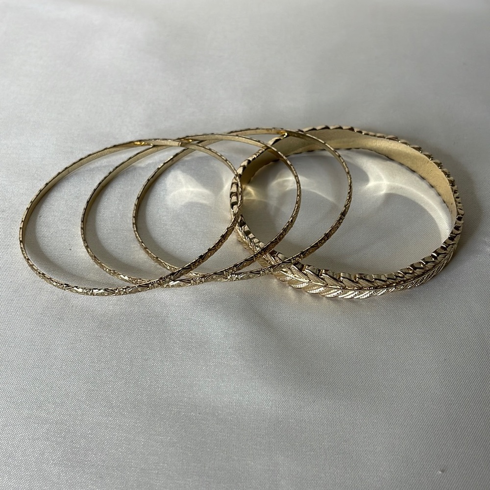 Bracelets, set of 4 gold tone